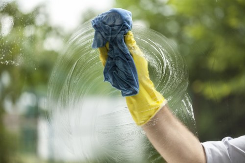 Cleaner following safe carpet cleaning procedures indoors