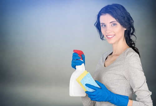 Professional carpet cleaner applying safe chemical handling